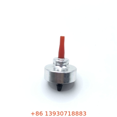 Une soupape de remplissage universelle de butane pour les poêles de camping portables.
